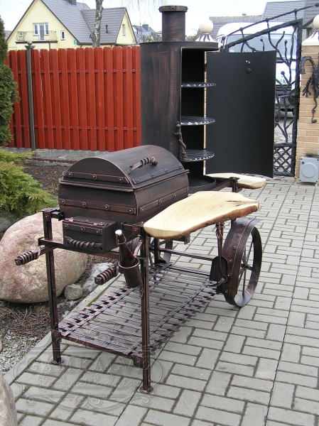 Barbeque with an integrated meat smoking facility with wheels KEG