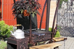 Barbeque with an integrated meat smoking facility with a canopy