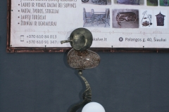 A standing light fixture with a stone COSMOS